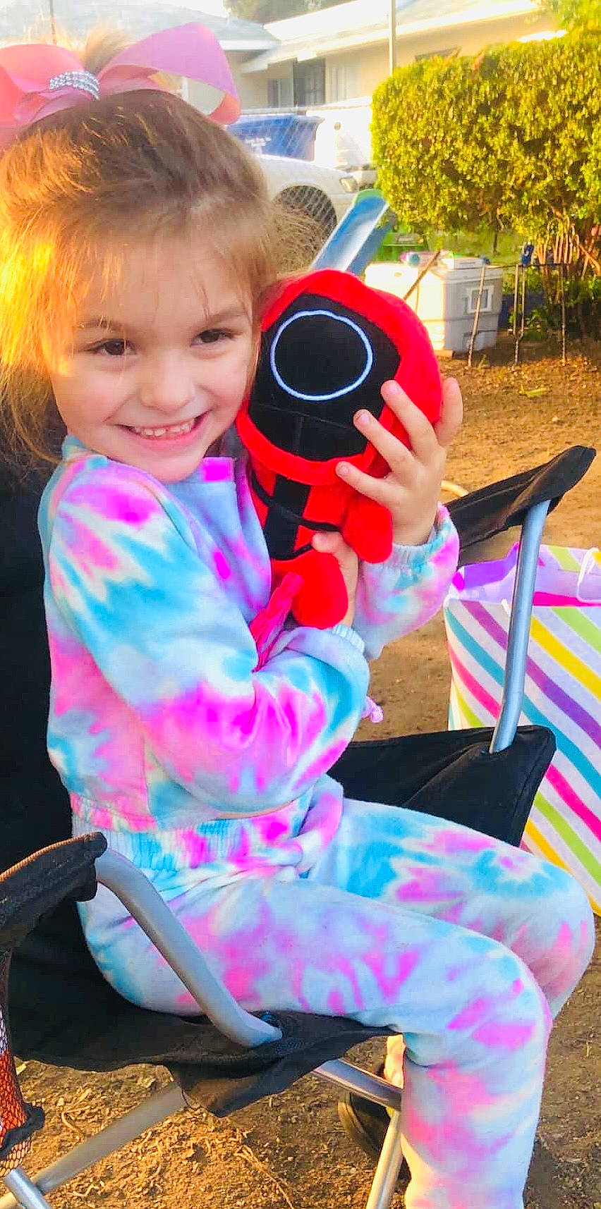 Hailey joined the competition — help win amazing prizes! baby_toddler_clothing, beauty, blond, chair, child, eyewear, face, fun, grass, happy, joy, leisure, lip, magenta, person, personal_protective_equipment, pink, plant, recreation, sitting