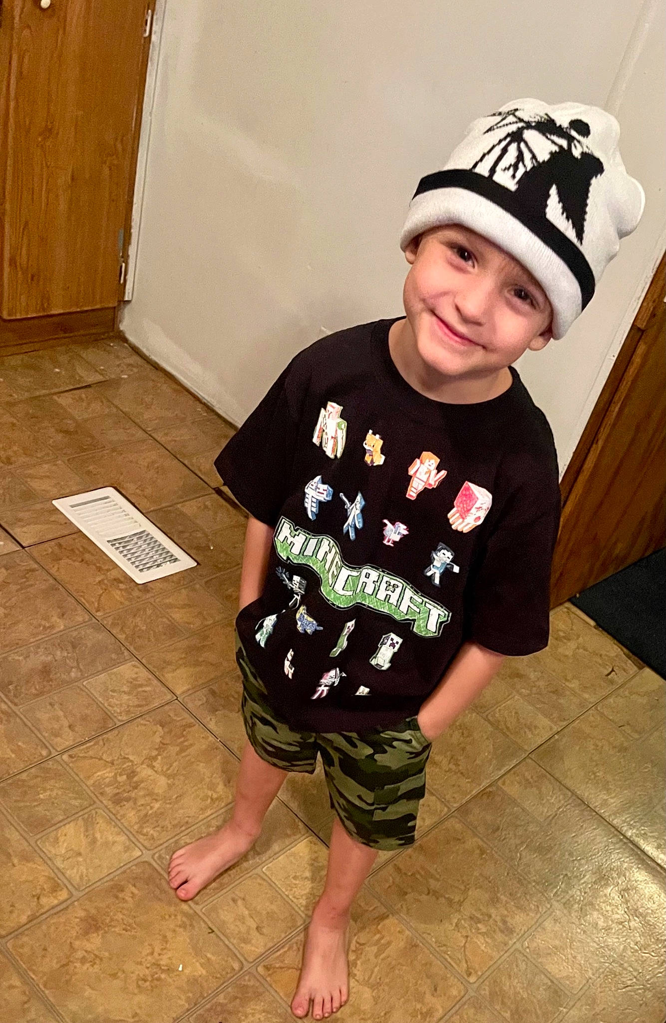 Ender is registered to the contest to win money with this photo: arm, baby_toddler_clothing, baseball_cap, cap, clothing, costume_hat, fashion_accessory, flash_photography, flooring, fun, happy, hardwood, hat, head, headwear, joy, knee, person, sleeve, smile
