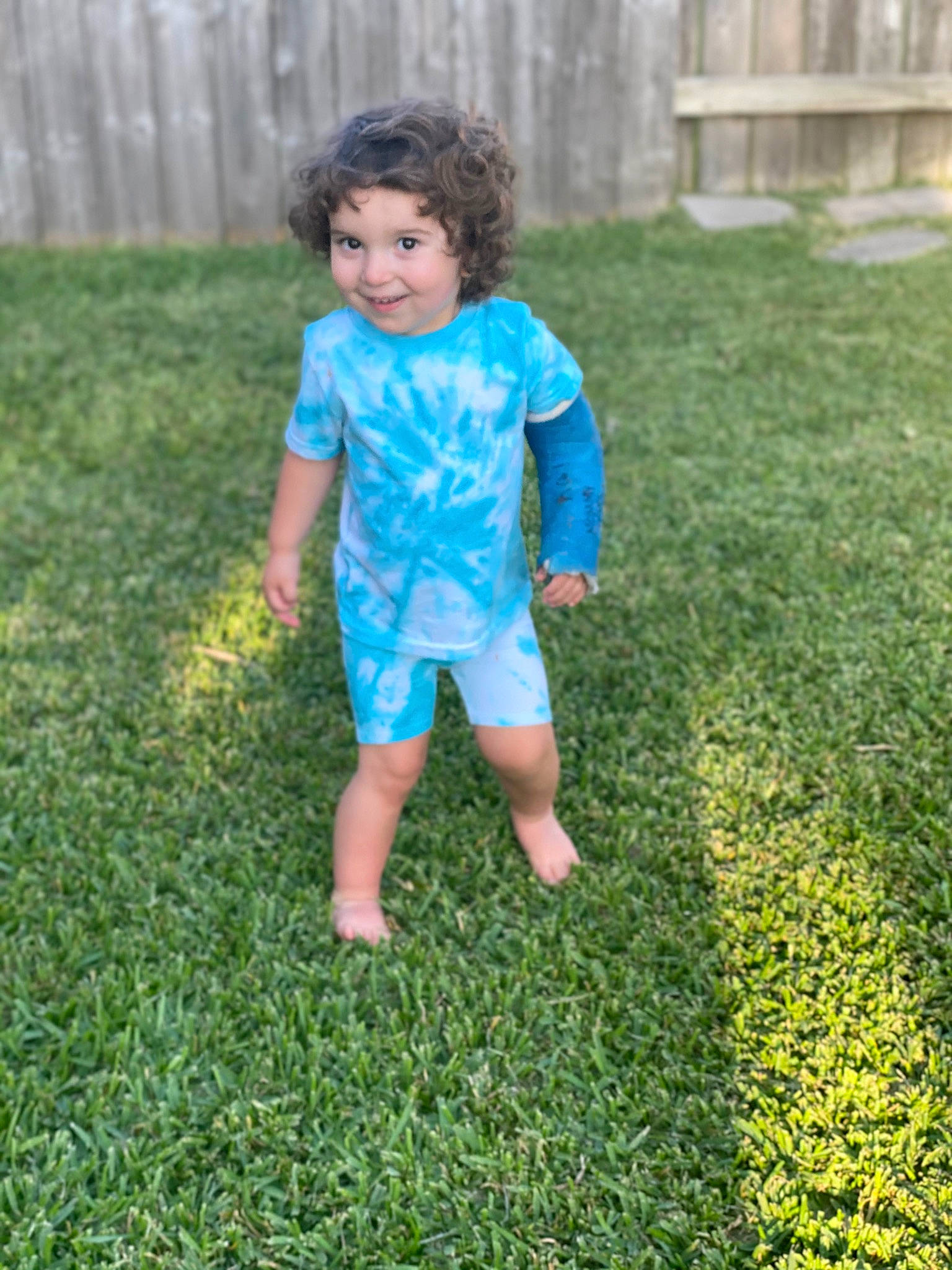 Raedyn is registered to the contest to win money with this photo: baby_toddler_clothing, child, electric_blue, fun, garden, grass, grass_family, grassland, groundcover, happy, joy, lawn, meadow, nature, people_in_nature, person, plant, shrub, sleeve, summer