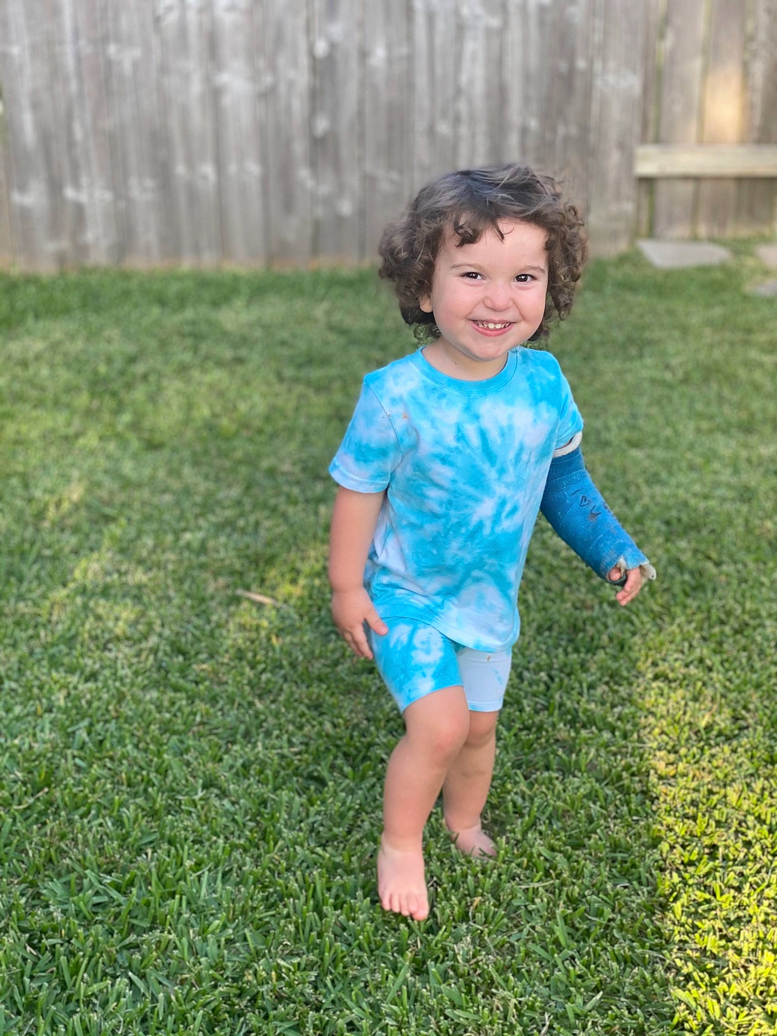 Raedyn joined the competition — help win amazing prizes! baby_toddler_clothing, barefoot, child, clothing, electric_blue, face, fun, grass, grass_family, grassland, groundcover, happy, joy, lawn, leisure, meadow, people_in_nature, person, recreation, sleeve