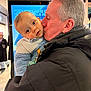 Mylan participe au concours pour gagner de l'argent avec cette photo : baby, child, man, kiss, love, indoor, fleece_jacket, cozy_clothing, portrait, affection, peugeot_advertisement, warmth, family, grandparent, shopping_mall, people, face, holding, expression, toddler