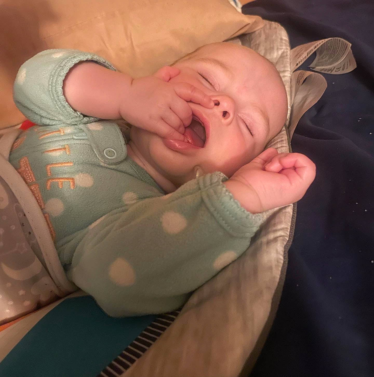 Dianna is registered to the contest to win money with this photo: baby, baby_toddler_clothing, child, comfort, elbow, finger, flesh, foot, hat, human_body, human_leg, knee, mouth, nail, peach, person, skin, thigh, thumb, toddler