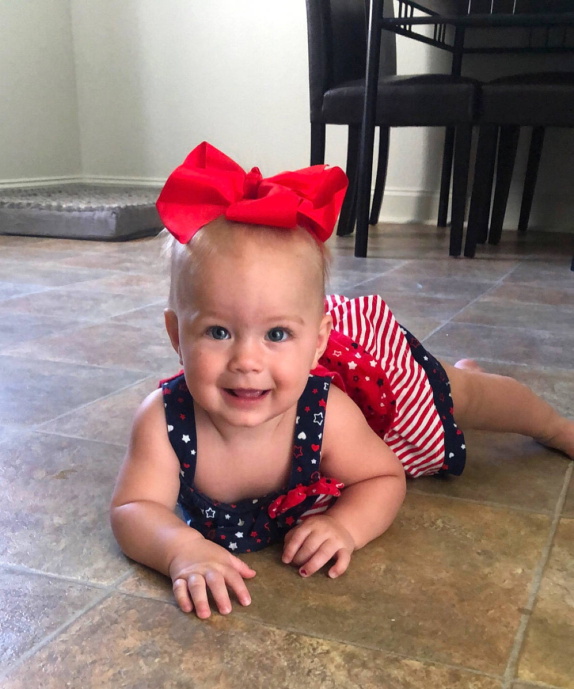 Rilee is registered to the contest to win money with this photo: baby, baby_toddler_clothing, beauty, child, ear, face, fashion_accessory, fun, hair_accessory, head, headband, headgear, joy, leg, person, pink, skin, smile, summer, technology