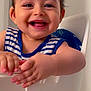Loai a rejoint le concours — aidez-le/la à gagner de superbes lots ! baby, child, smiling, happy, high_chair, clothing, striped_shirt, face, hands, indoors, person, cute, infant, young_child, portrait, skin, cheerful, blue, white, toddler