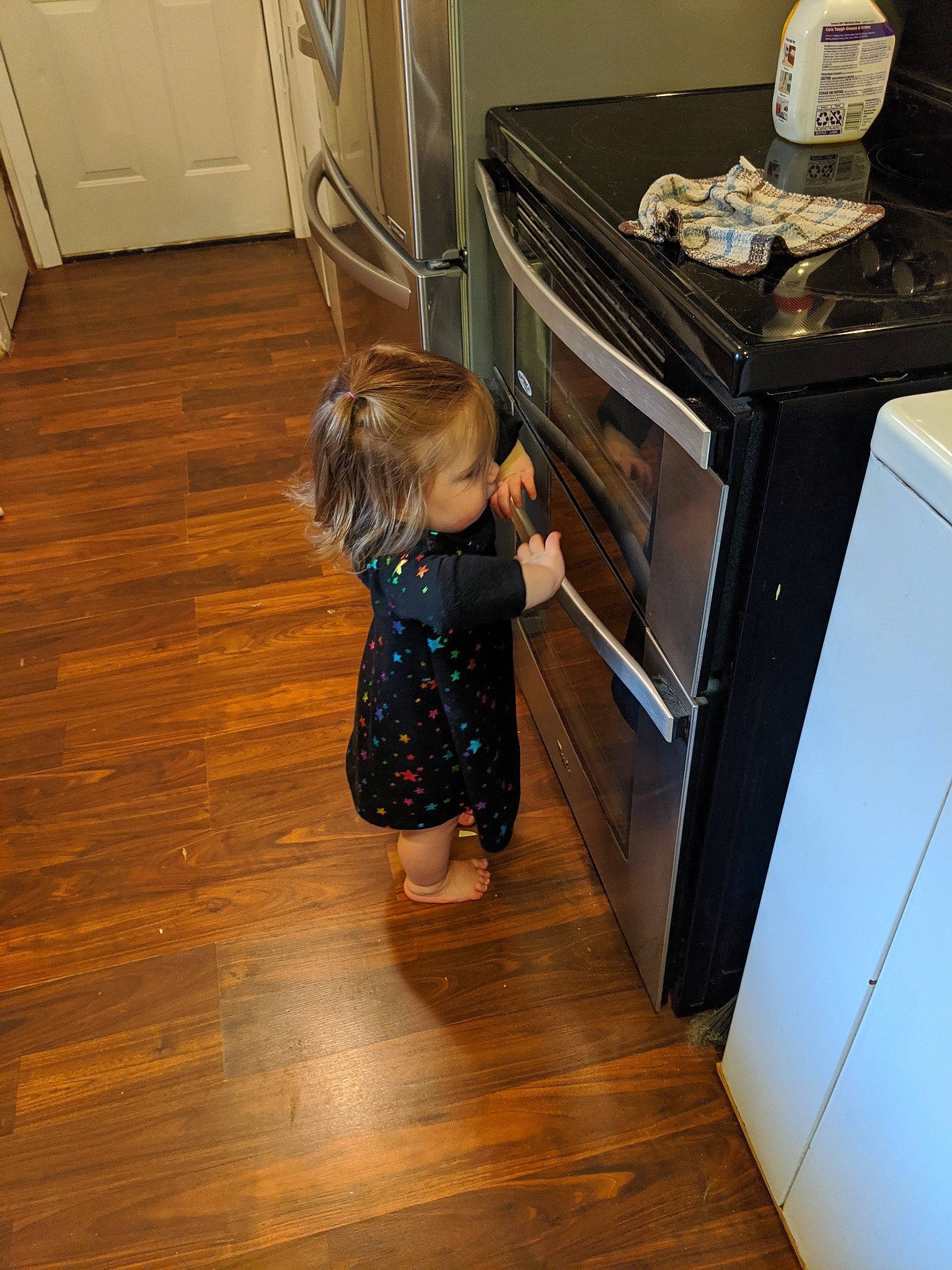 Reagan joined the competition — help win amazing prizes! floor, flooring, hardwood, laminate_flooring, leg, person, room, standing, tile, toddler, wood, wood_flooring, wood_stain