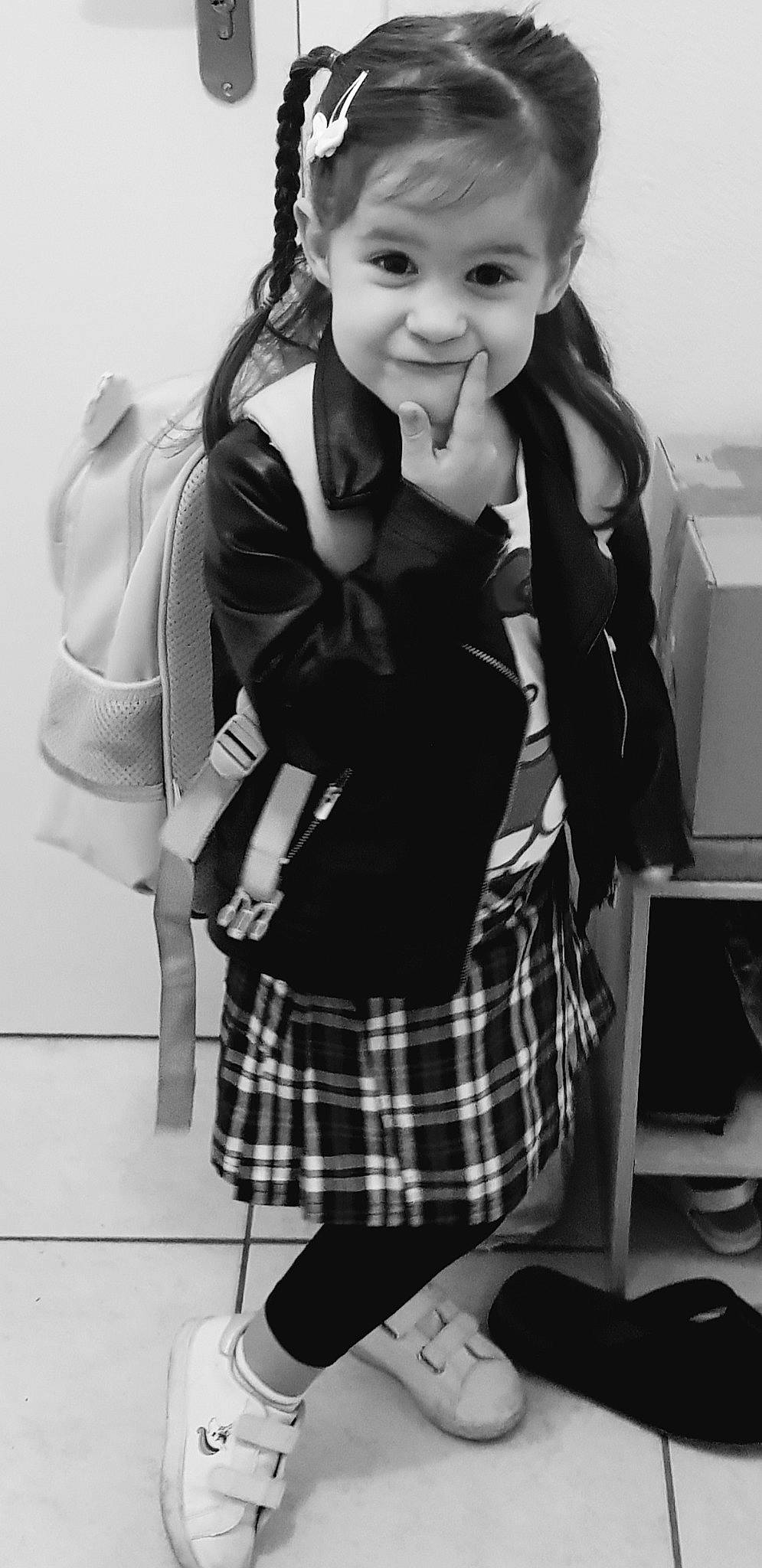 Manon participe au concours pour gagner de l'argent avec cette photo : black, black_and_white, flash_photography, hairstyle, happy, human_body, joy, pattern, person, photograph, plaid, school_uniform, sleeve, smile, snapshot, standing, style, tartan, thigh, tie