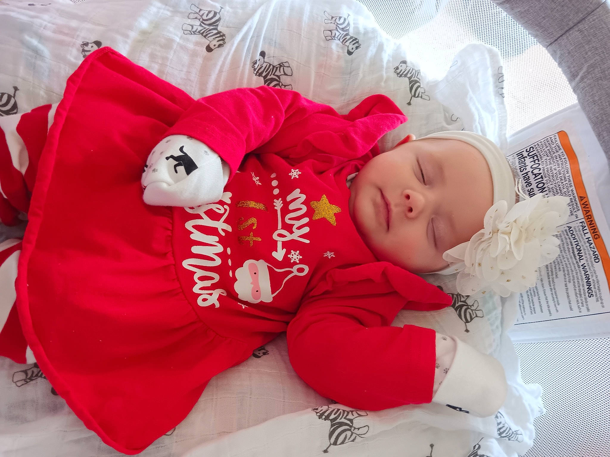 Hannah joined the competition — help win amazing prizes! baby, baby_products, baby_sleeping, baby_toddler_clothing, carmine, child, comfort, couch, event, font, hat, headwear, lap, linens, nap, person, room, sitting, sleeve, sock