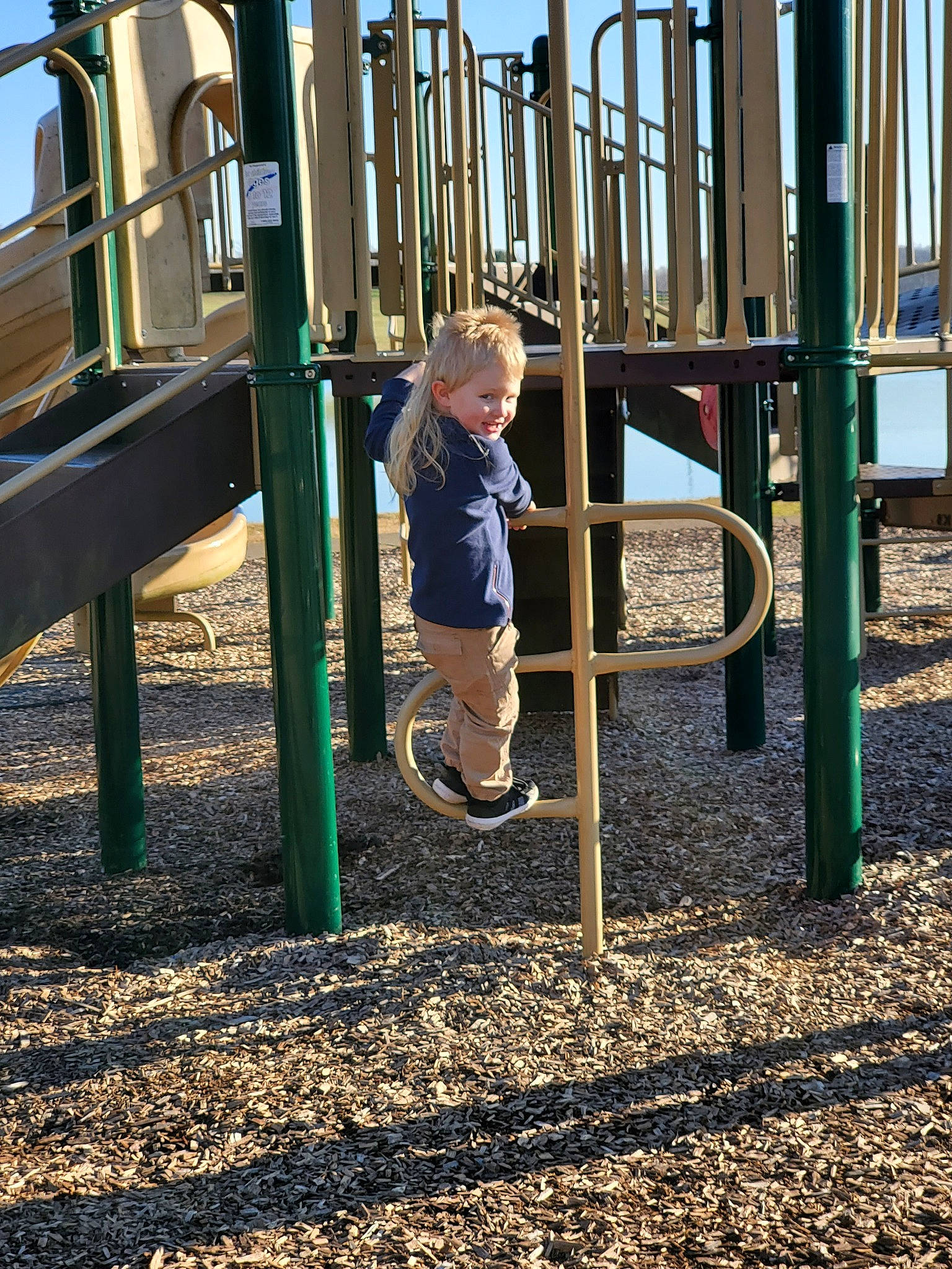 Bailey is registered to the contest to win money with this photo: child, city, fun, human_settlement, joy, outdoor_play_equipment, person, play, playground, public_space, recreation, toddler