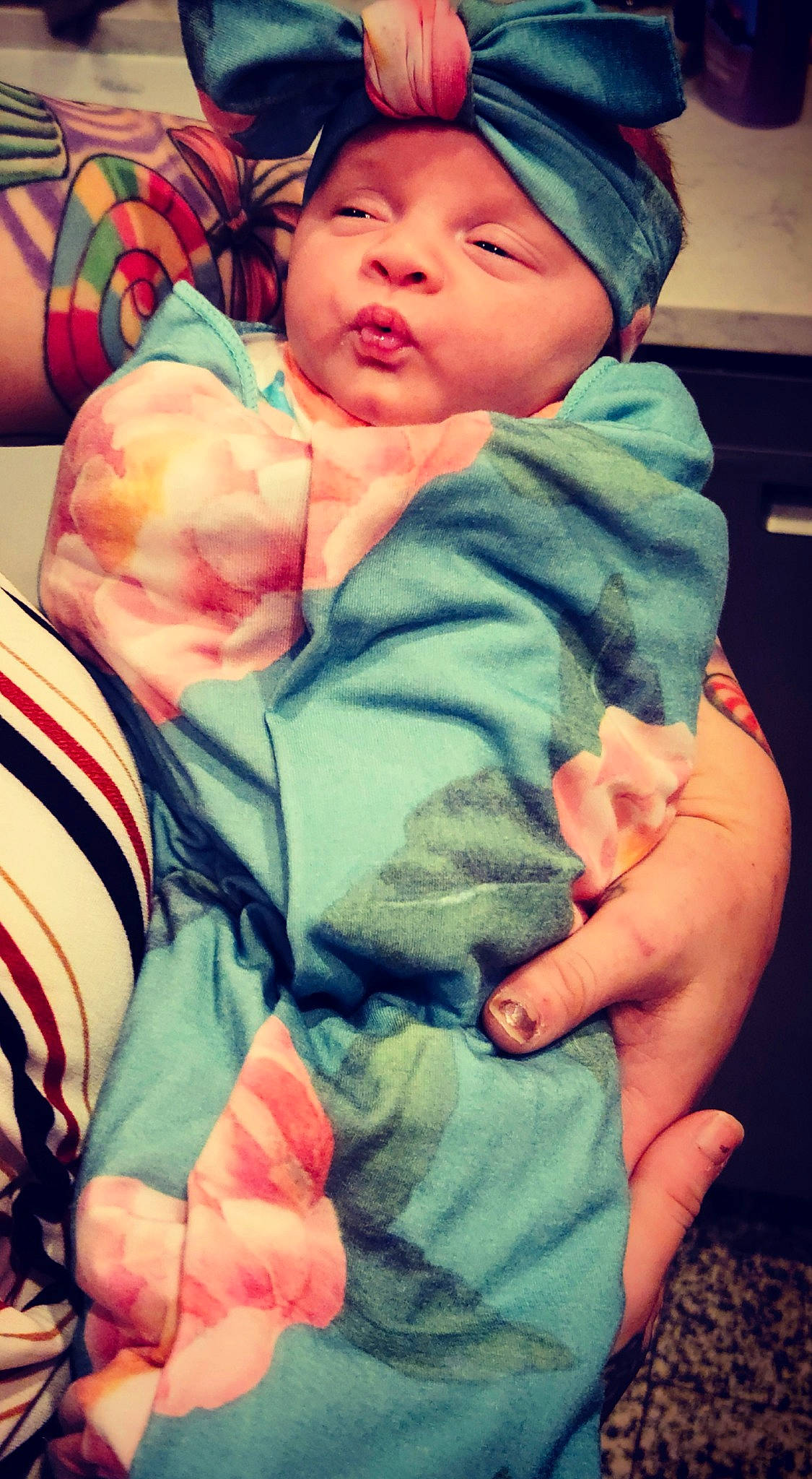 Legacy joined the competition — help win amazing prizes! baby, baby_products, baby_toddler_clothing, beanie, cap, cheek, child, comfort, electric_blue, finger, fun, gesture, green, happy, headwear, linens, orange, person, red, sitting