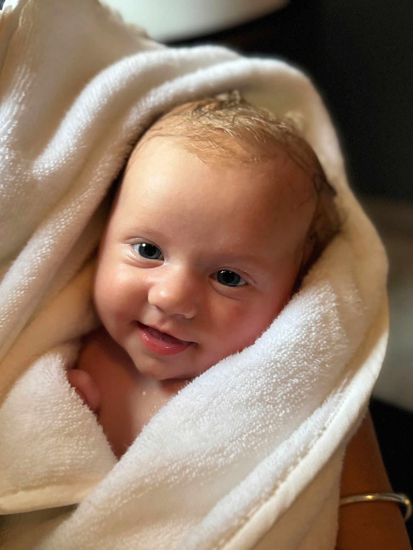 Bodhi joined the competition — help win amazing prizes! baby, infant, towel, smile, face, skin, eyes, hair, wrapped, soft, cute, child, newborn, portrait, happy, warm, cozy, closeup, person, indoors