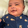 Kyeson joined the competition — help win amazing prizes! baby, infant, smile, face, blue_clothing, onesie, lion_print, cute, lying_down, indoors, child, happy, cheeks, person, apparel, closeup, skin, head, newborn, portrait