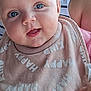 baby, infant, blue_eyes, bib, smiling, drool, close_up, person, child, cute, happy, clothing, striped_shirt, holding, skin, face, mouth_open, hand, indoor, portrait
