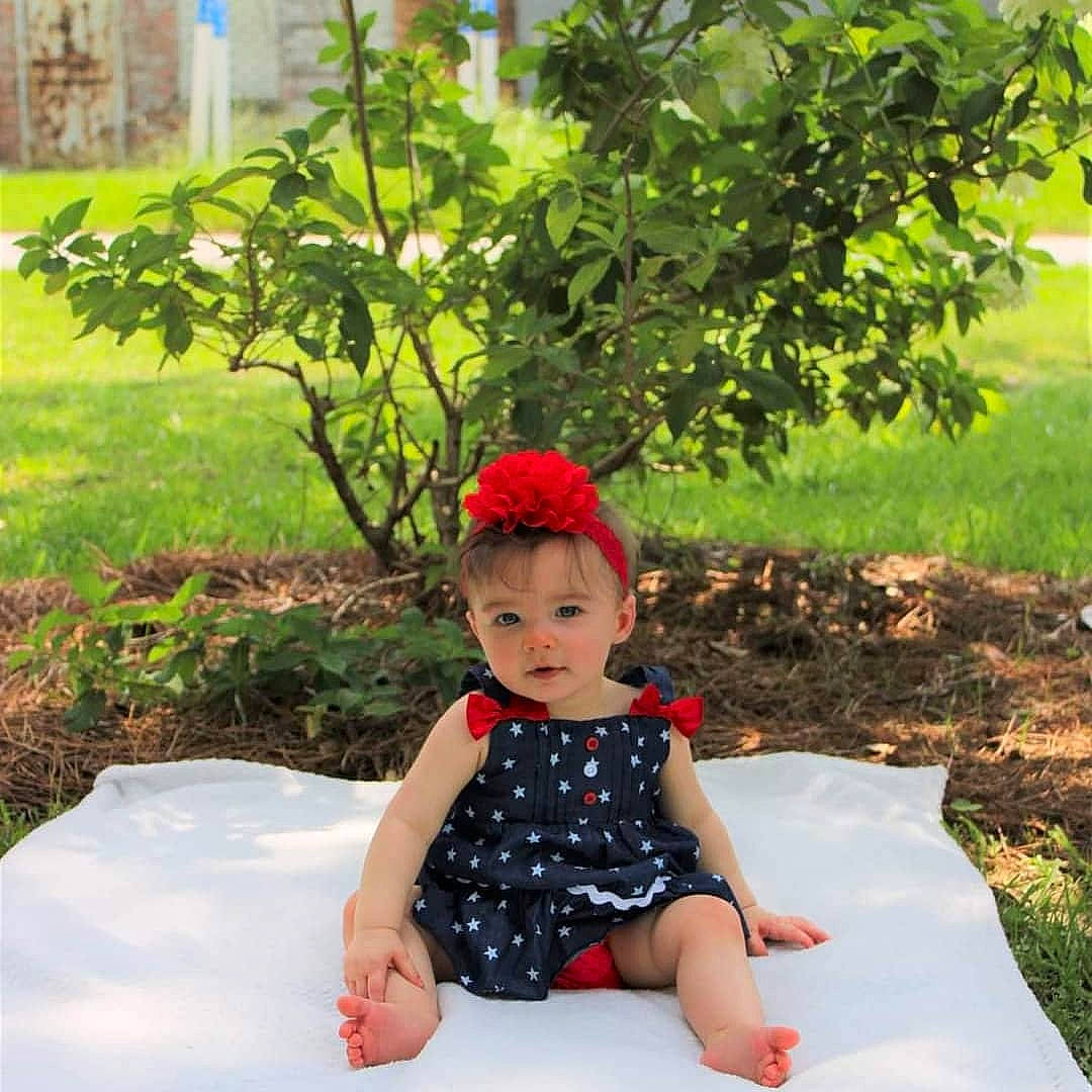 Ansleigh is registered to the contest to win money with this photo: baby, baby_toddler_clothing, carmine, fashion_accessory, fun, garden, grass, green, hat, leaf, leisure, morning, pattern, people_in_nature, person, plant, sleeve, spring, summer, toddler