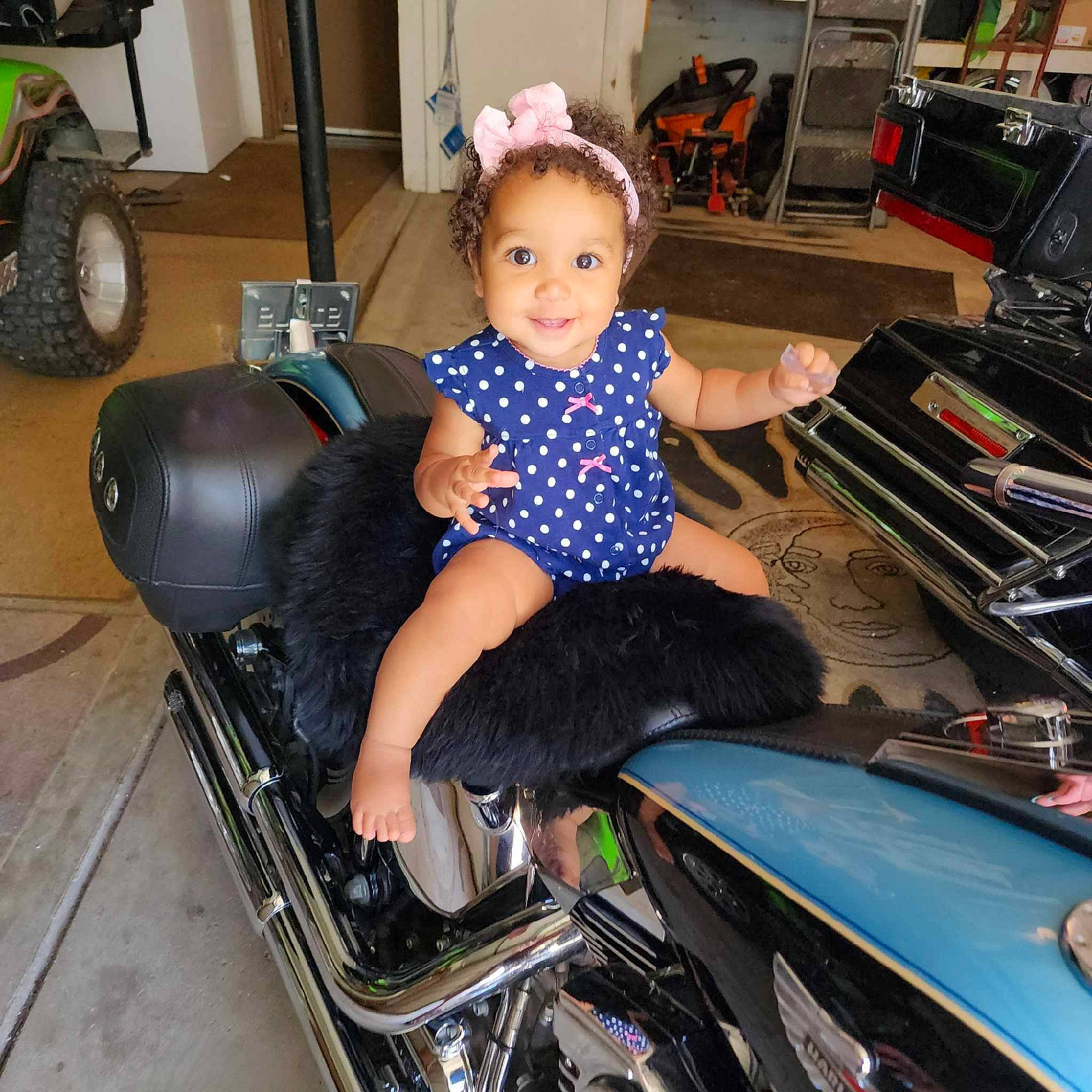 Tiana is registered to the contest to win money with this photo: auto_part, automotive_design, automotive_exterior, automotive_lighting, automotive_tire, automotive_wheel_system, baby_toddler_clothing, bumper, fender, fun, hood, human_leg, joy, leg, leisure, motor_vehicle, person, thigh, tire, toddler