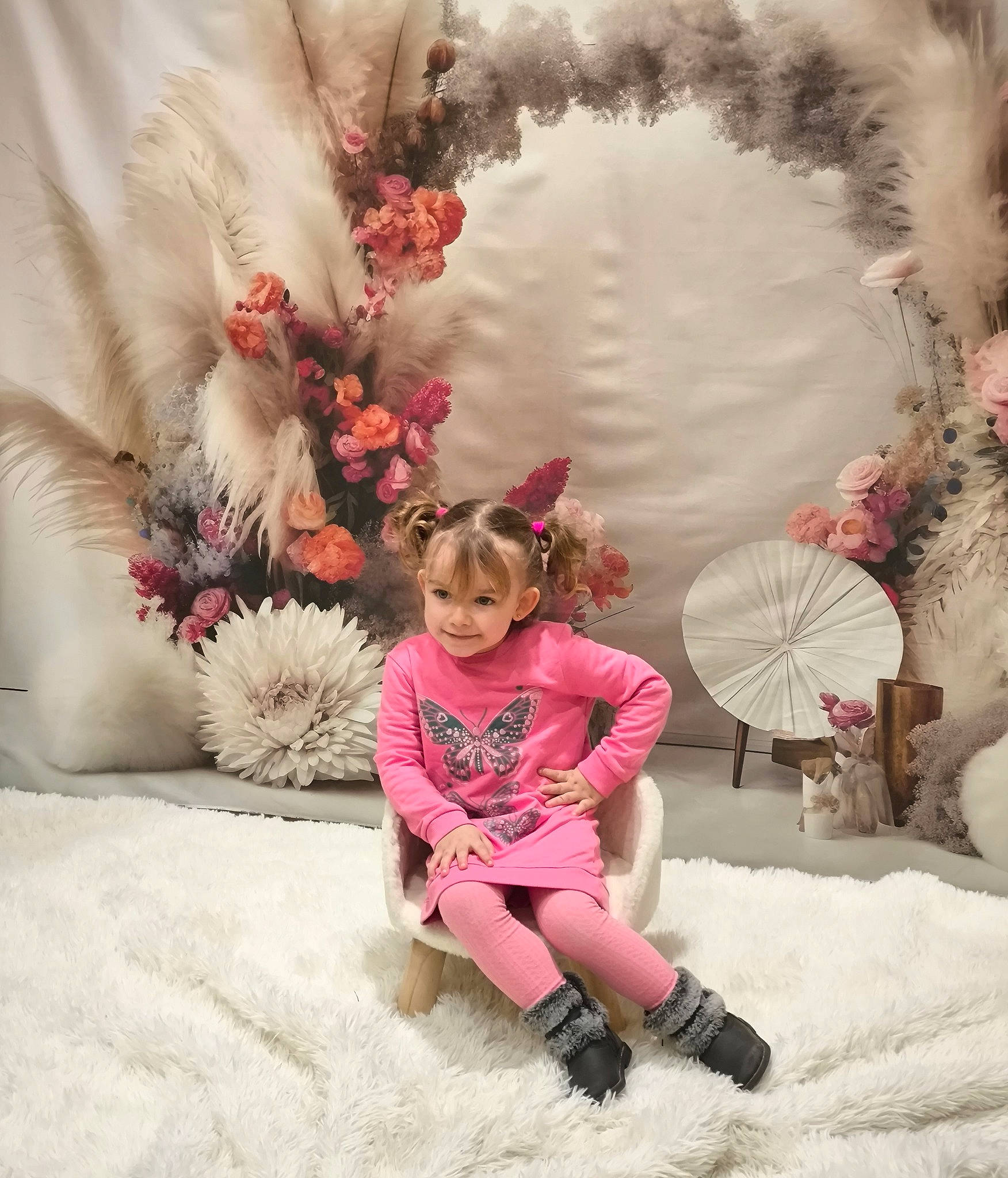 Lizéah participe au concours pour gagner de l'argent avec cette photo : boot, child, dress, flower, freezing, fur, happy, headpiece, magenta, pattern, person, petal, pink, playing_in_the_snow, sitting, sleeve, textile, toddler, tree, visual_arts