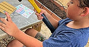 Carlos joined the competition — help win amazing prizes! activity, bench, boy, child, concrete, daylight, fence, garden, greenery, hammer, outdoor, person, play, shorts, sideview, tool, tree, tshirt, wood, woodchips