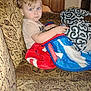 Myles joined the competition — help win amazing prizes! black_and_white_blanket, blanket, blue_blanket, blue_eyes, casual_clothing, child, couch, curious_expression, furniture, holding_object, home, indoor, light_hair, living_room, patterned_couch, portrait, red_blanket, seated, toddler, young_child