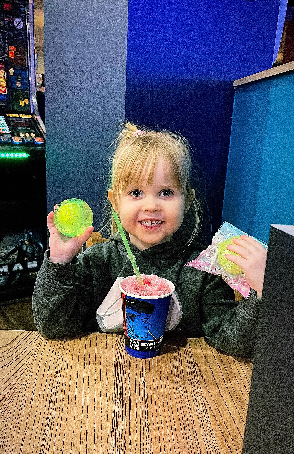 Lily is registered to the contest to win money with this photo: baby_toddler_clothing, beauty, blackboard, blond, child, flooring, fun, happy, joy, leisure, person, play, product, purple, room, sitting, smile, standing, table, toddler