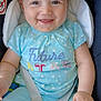 baby, child, smiling, blue_clothing, car_seat, seatbelt, happy, face, infant, cute, star_pattern, sitting, portrait, young_child, safety, clothing, expression, closeup, indoor, person