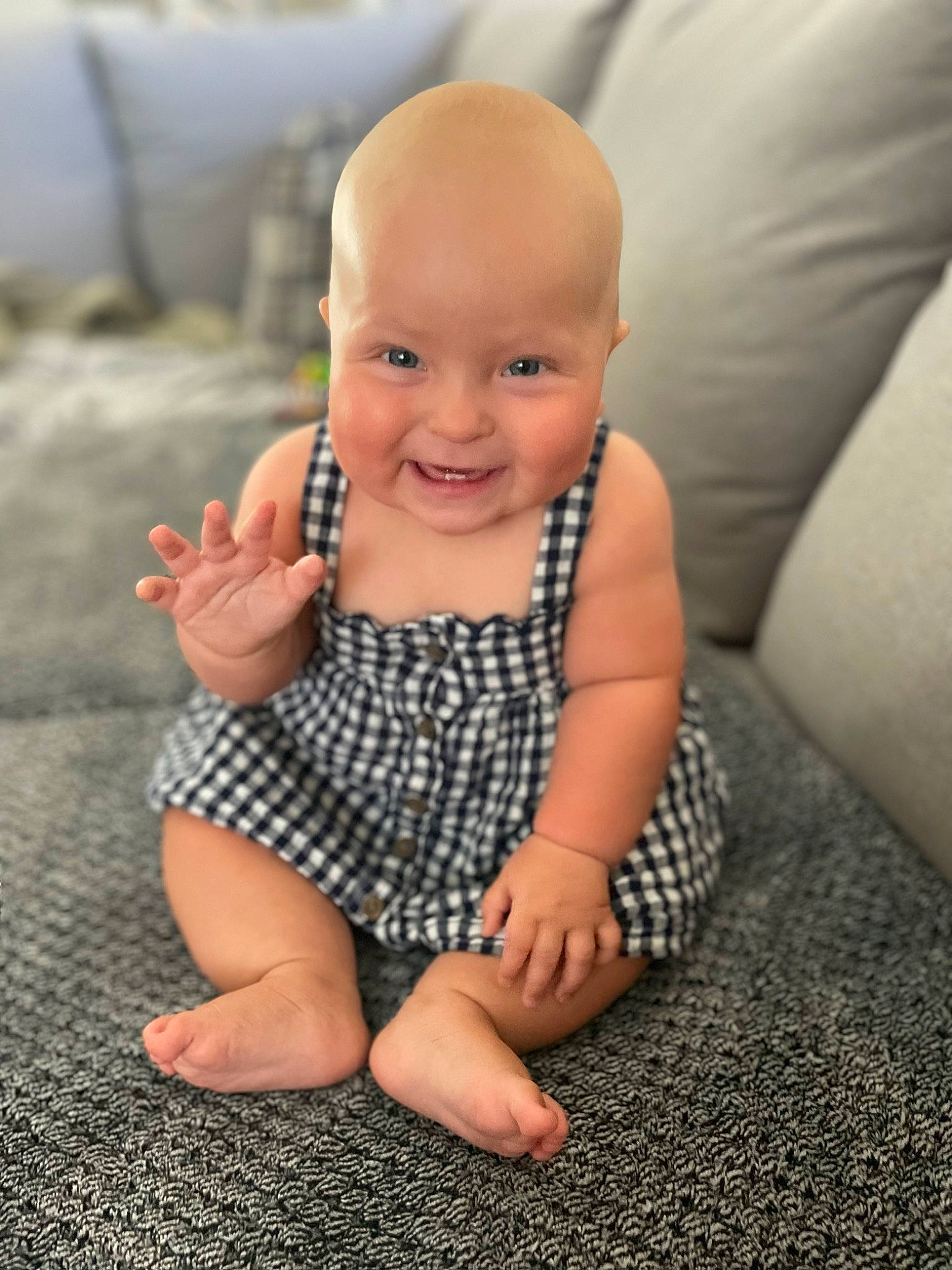 Skyla joined the competition — help win amazing prizes! baby, baby_toddler_clothing, comfort, finger, floor, flooring, foot, fun, gesture, grass, hand, happy, human_leg, joy, nail, person, sitting, skin, sleeve, smile