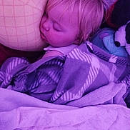 Rae is registered to the contest to win money with this photo: child, toddler, sleeping, pillow, blanket, plush_toy, bed, nap, indoor, cozy, soft_toys, face, hair, comfort, rest, peaceful, purple_light, closeup, portrait, cuddling