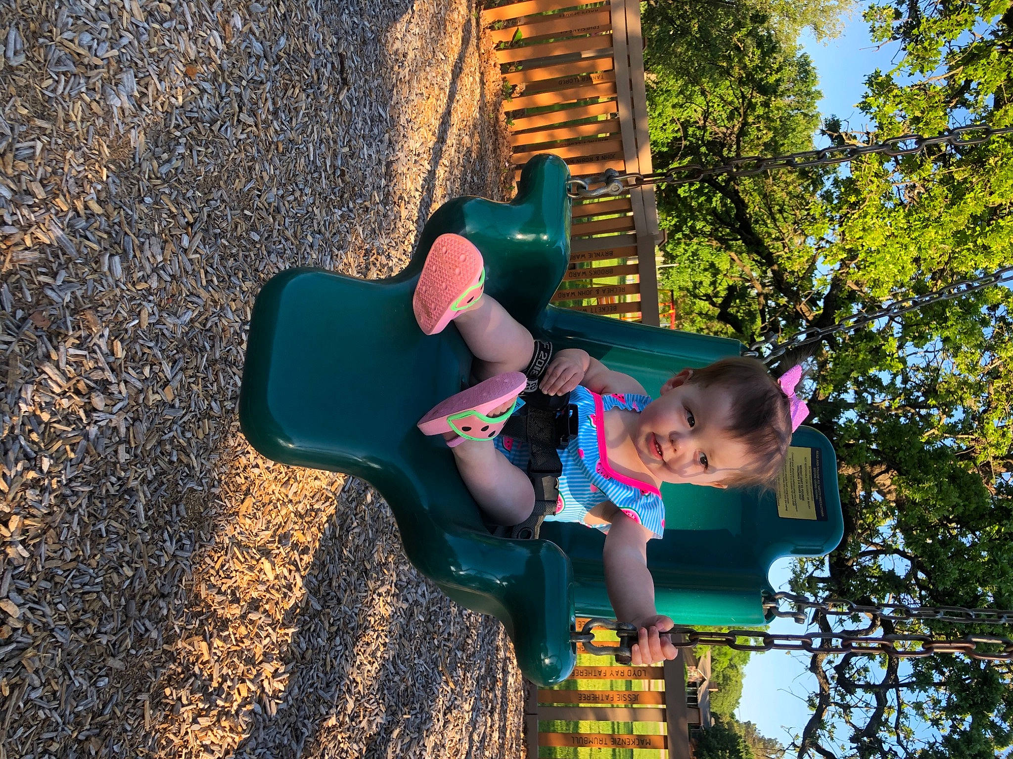 Mckinlee is registered to the contest to win money with this photo: baby_toddler_clothing, child, city, electric_blue, fun, grass, happy, leaf, leisure, outdoor_play_equipment, people_in_nature, person, play, playground, playground_slide, public_space, recreation, soil, t_shirt, toddler