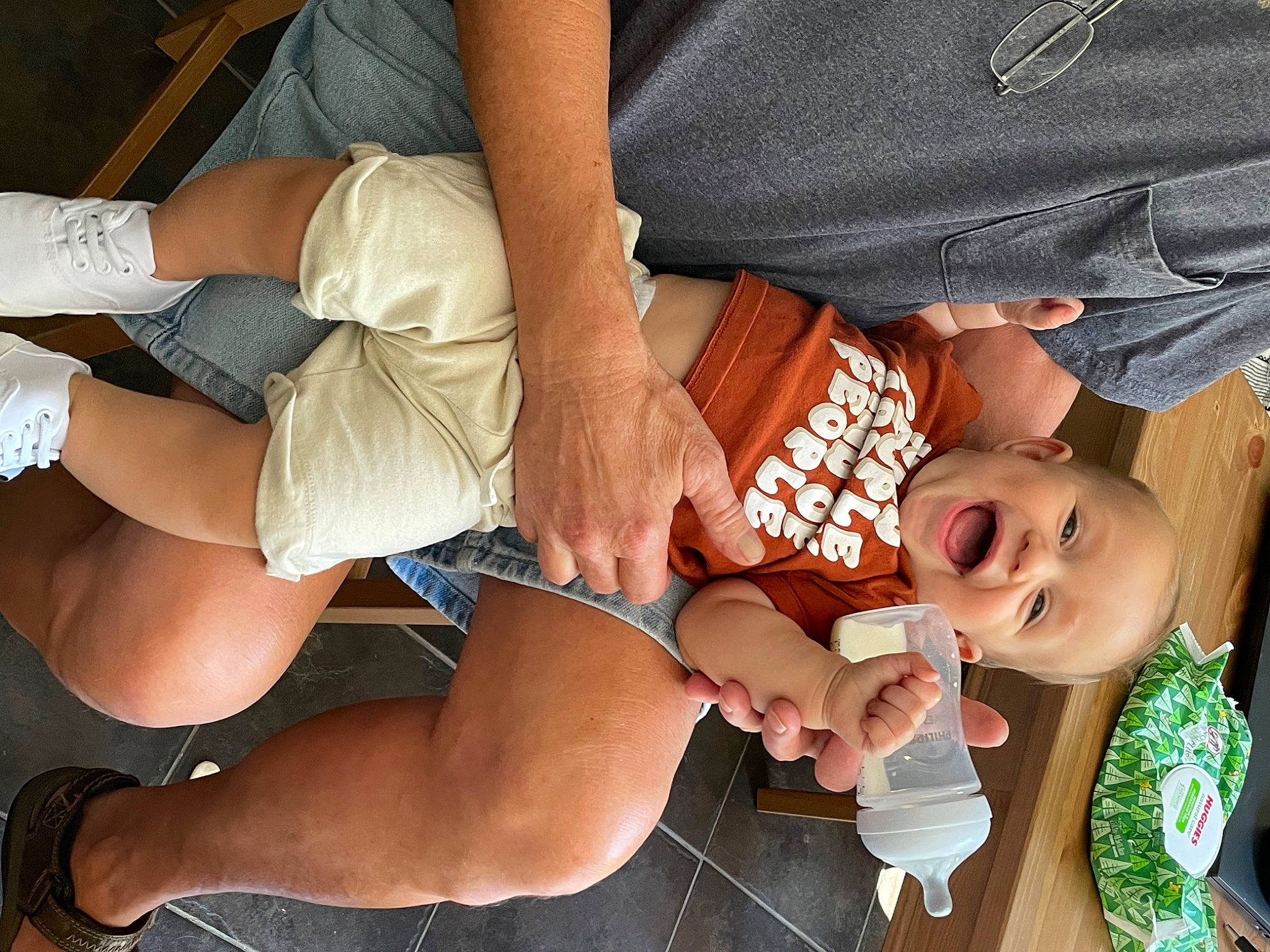 Beau is registered to the contest to win money with this photo: baby, chest, elbow, event, finger, fun, happy, human_leg, joint, knee, lap, mouth, nail, person, shorts, smile, thigh, thumb, toddler, trunk