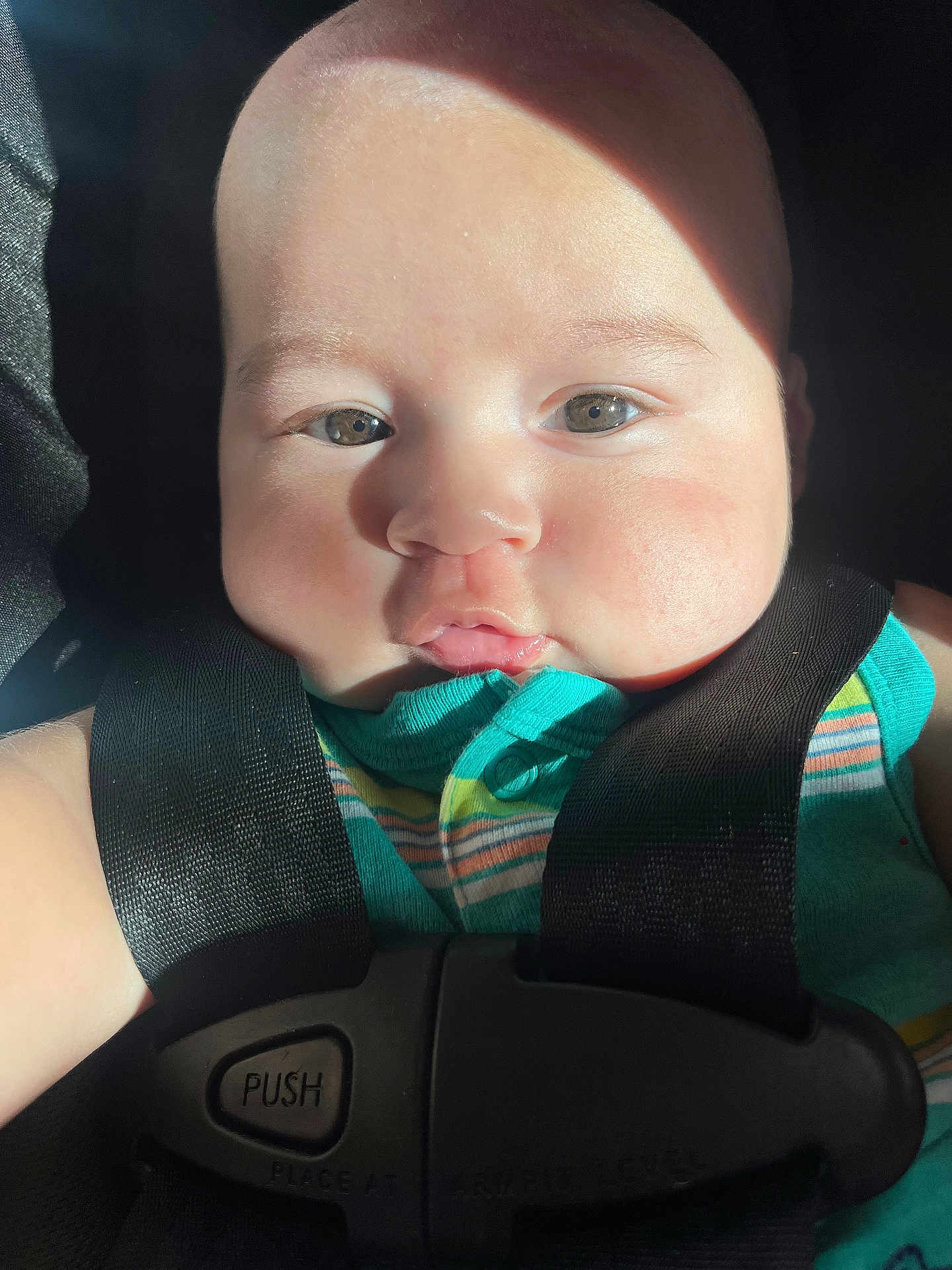 Eithan joined the competition — help win amazing prizes! baby, infant, face, car_seat, safety_harness, child, closeup, skin, eyes, sunlight, stripes, clothing, seatbelt, young_child, cute, portrait, seat, sitting, head, babywearing