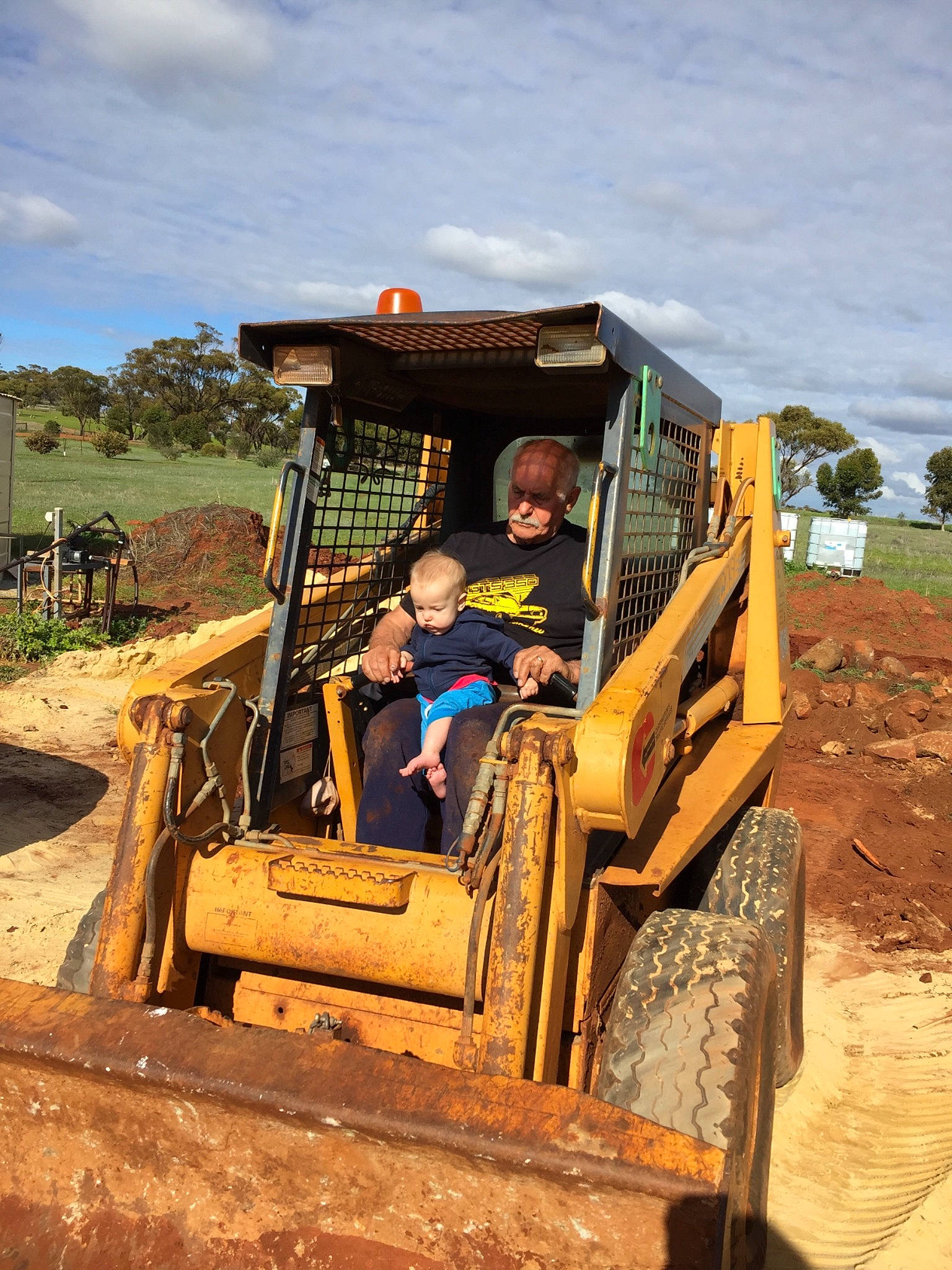Hamish is registered to the contest to win money with this photo: bulldozer, construction_equipment, fun, mode_of_transport, off_road_vehicle, off_roading, person, rural_area, soil, tractor, transport, vehicle