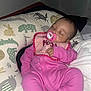 Ameriah joined the competition — help win amazing prizes! baby, sleeping, pacifier, pink_onesie, bib, pillow, animal_print, blanket, infant, child, indoors, resting, cute, soft_lighting, cozy, portrait, person, toddler, sleep, peaceful