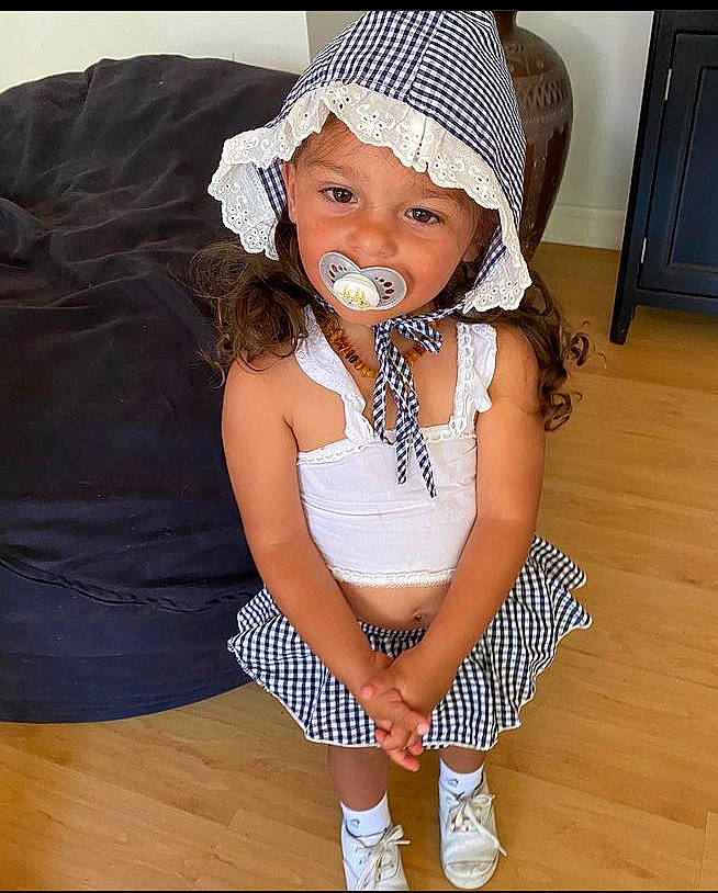 Alexxis is registered to the contest to win money with this photo: baby, baby_toddler_clothing, cap, child, costume_hat, fashion_accessory, happy, headband, headgear, headwear, human_leg, jewellery, knee, neck, pattern, person, sleeve, sock, thigh, toddler