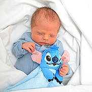 Arlo joined the competition — help win amazing prizes! newborn, baby, sleeping, blue_clothing, plush_toy, stuffed_animal, blanket, soft, cute, infant, peaceful, child, cozy, indoor, portrait, resting, toddler, hand, face, lying_down