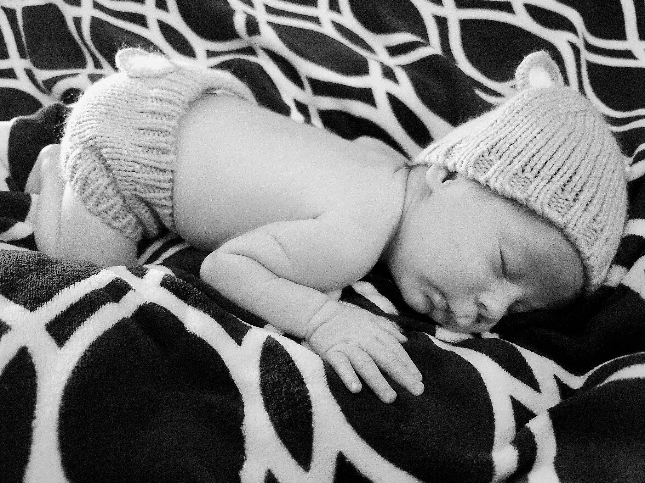 Sammie is registered to the contest to win money with this photo: baby, baby_sleeping, baby_toddler_clothing, bedding, black, black_and_white, child, comfort, grass, happy, headwear, human_leg, infant_bed, linens, monochrome, monochrome_photography, pattern, person, style, thigh