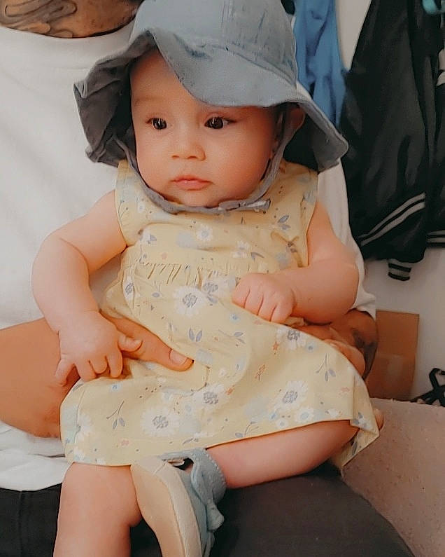 Chevelle is registered to the contest to win money with this photo: baby, baby_toddler_clothing, beauty, cap, child, comfort, hat, headgear, headwear, knee, neck, organ, pattern, person, pink, skin, sleeve, thigh, toddler, trunk