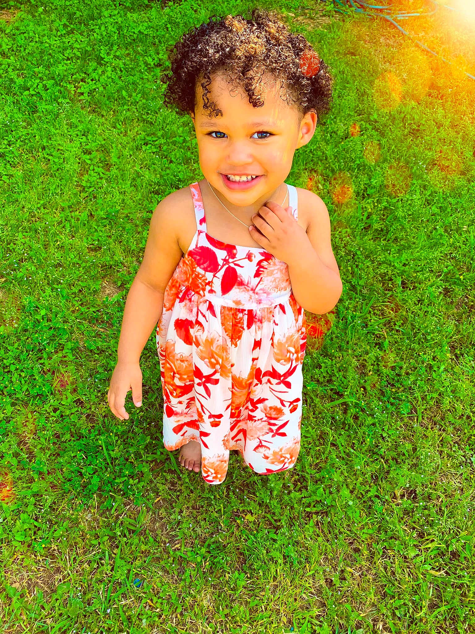 Khalia is registered to the contest to win money with this photo: baby_toddler_clothing, child, child_model, dress, grass, green, happy, joy, meadow, pattern, people_in_nature, person, plant, play, smile, spring, summer, toddler