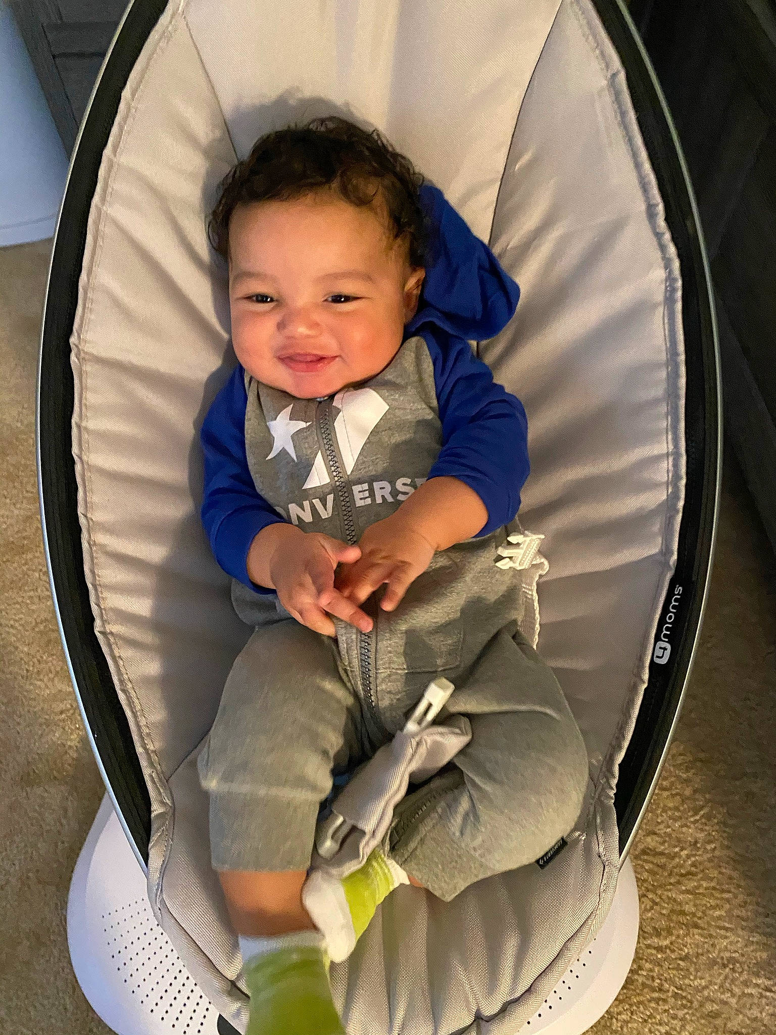 Mateo Davis is registered to the contest to win money with this photo: arm, auto_part, automotive_tire, baby, chair, child, clothing, comfort, fun, grass, hairstyle, head, lap, mammal, organ, person, product, shoe, smile, sneakers