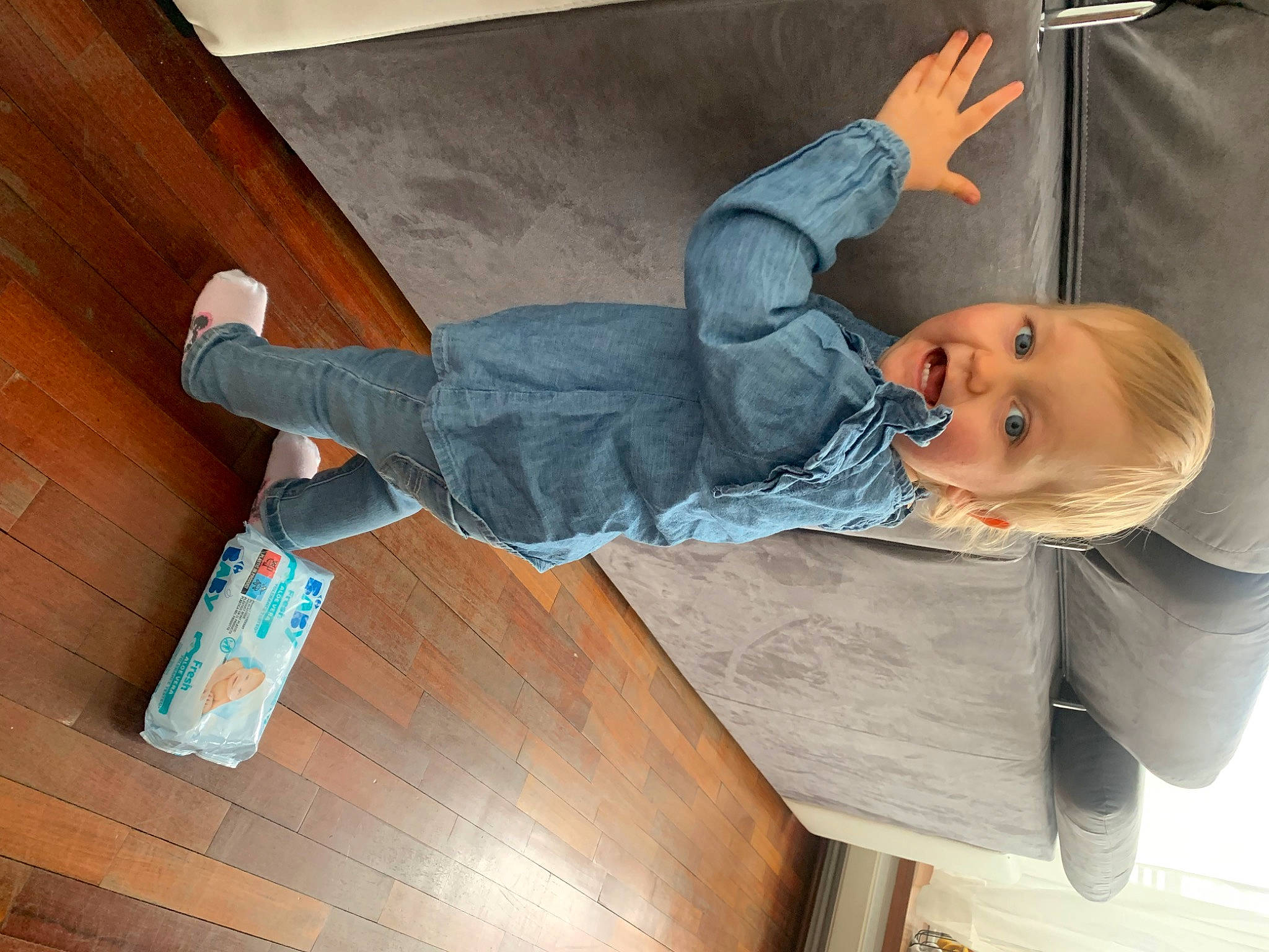 Ghjulia participe au concours pour gagner de l'argent avec cette photo : baby, baby_products, child, comfort, denim, flooring, fun, hardwood, knee, leisure, person, room, sitting, sock, toddler, varnish, wood, wood_stain