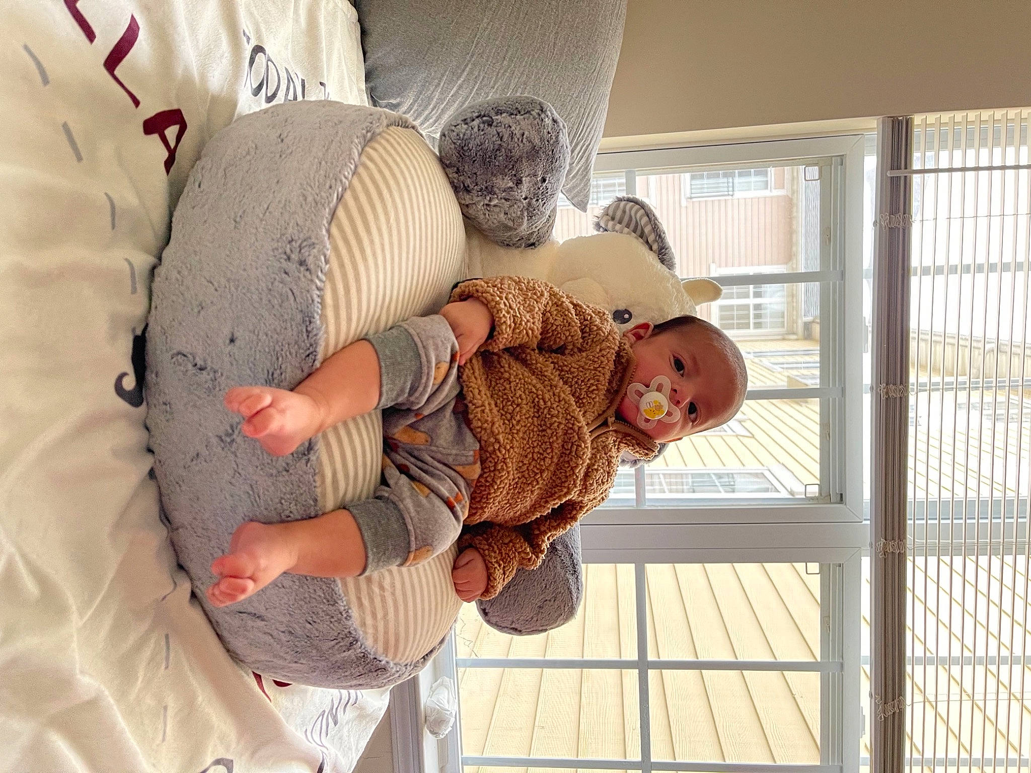 Oliver joined the competition — help win amazing prizes! baby, baby_products, baby_toddler_clothing, bed, child, comfort, fun, hat, leg, linens, pattern, person, product, room, sitting, stuffed_toy, sun_hat, textile, toddler, window