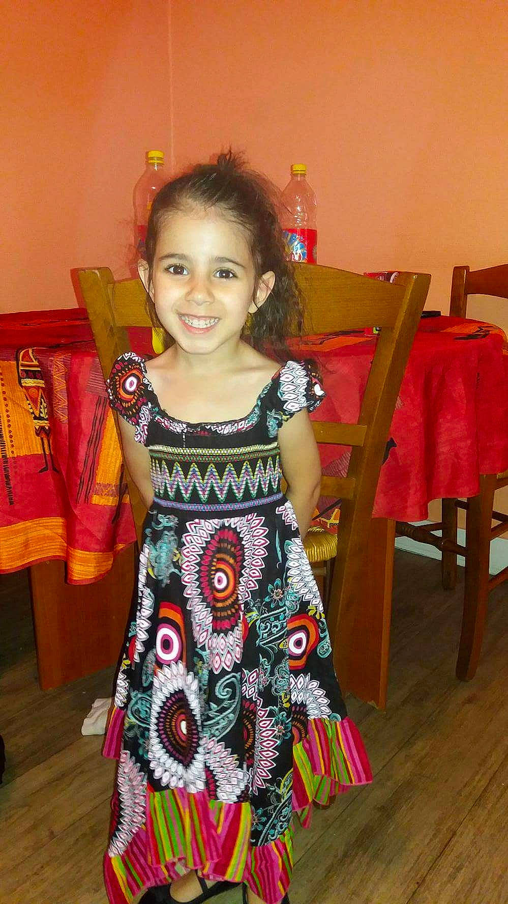 Kenza participe au concours pour gagner de l'argent avec cette photo : chair, child, dress, event, face, facial_expression, fashion, flooring, fun, hair, hairstyle, happy, head, iris, joy, people, person, skin, sleeve, smile