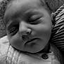 Amandine a rejoint le concours — aidez-le/la à gagner de superbes lots ! baby, infant, sleeping, newborn, portrait, closeup, black_and_white, face, eyelashes, button, clothing, blanket, striped_blanket, cute, peaceful, skin, nose, mouth, cheek, soft_texture