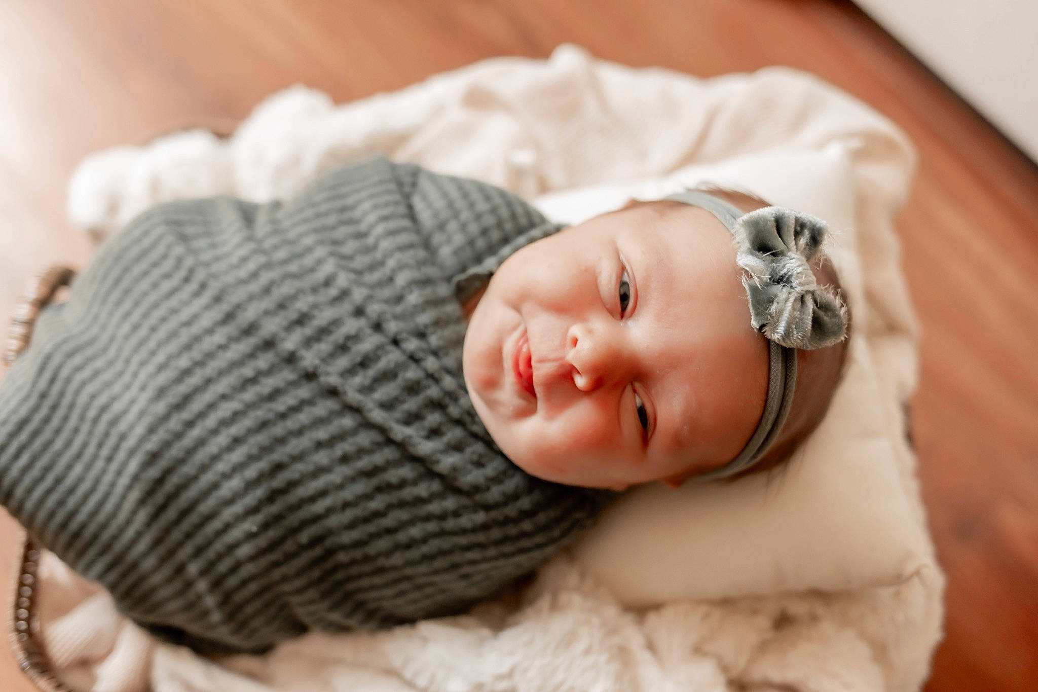 Everleigh is registered to the contest to win money with this photo: baby, baby_sleeping, baby_toddler_clothing, cap, child, comfort, dress, eye, fashion_accessory, flash_photography, happy, hat, headgear, knit_cap, linens, person, smile, toddler, wood, wool