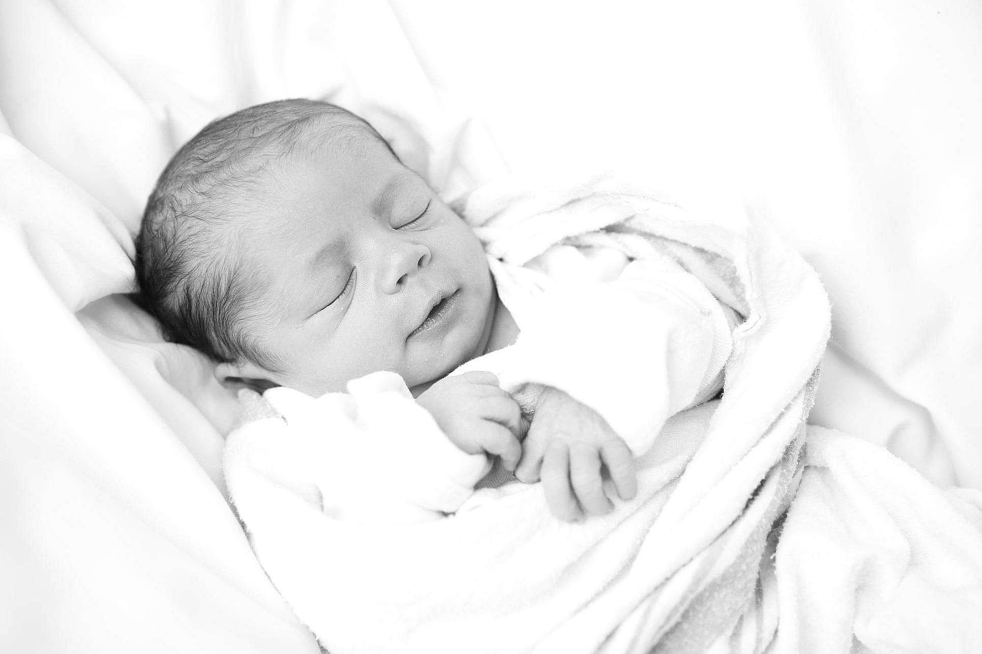Skyler is registered to the contest to win money with this photo: baby, baby_toddler_clothing, bedtime, child, comfort, event, flash_photography, fur, gesture, grass, happy, linens, monochrome, monochrome_photography, nap, person, portrait_photography, room, skin, sleep