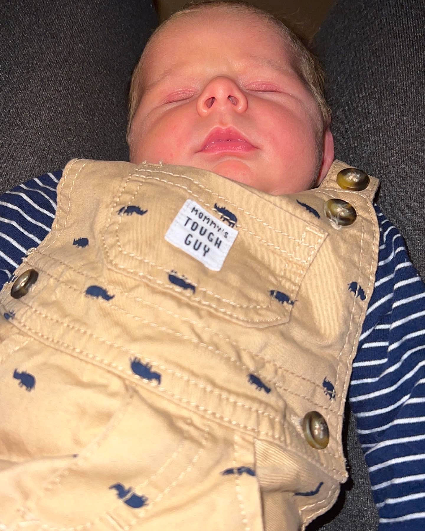Winston is registered to the contest to win money with this photo: baby, baby_products, baby_safety, baby_sleeping, baby_toddler_clothing, bedtime, cheek, child, collar, comfort, dress_shirt, font, linens, nose, pattern, person, product, sleeve, textile, thumb