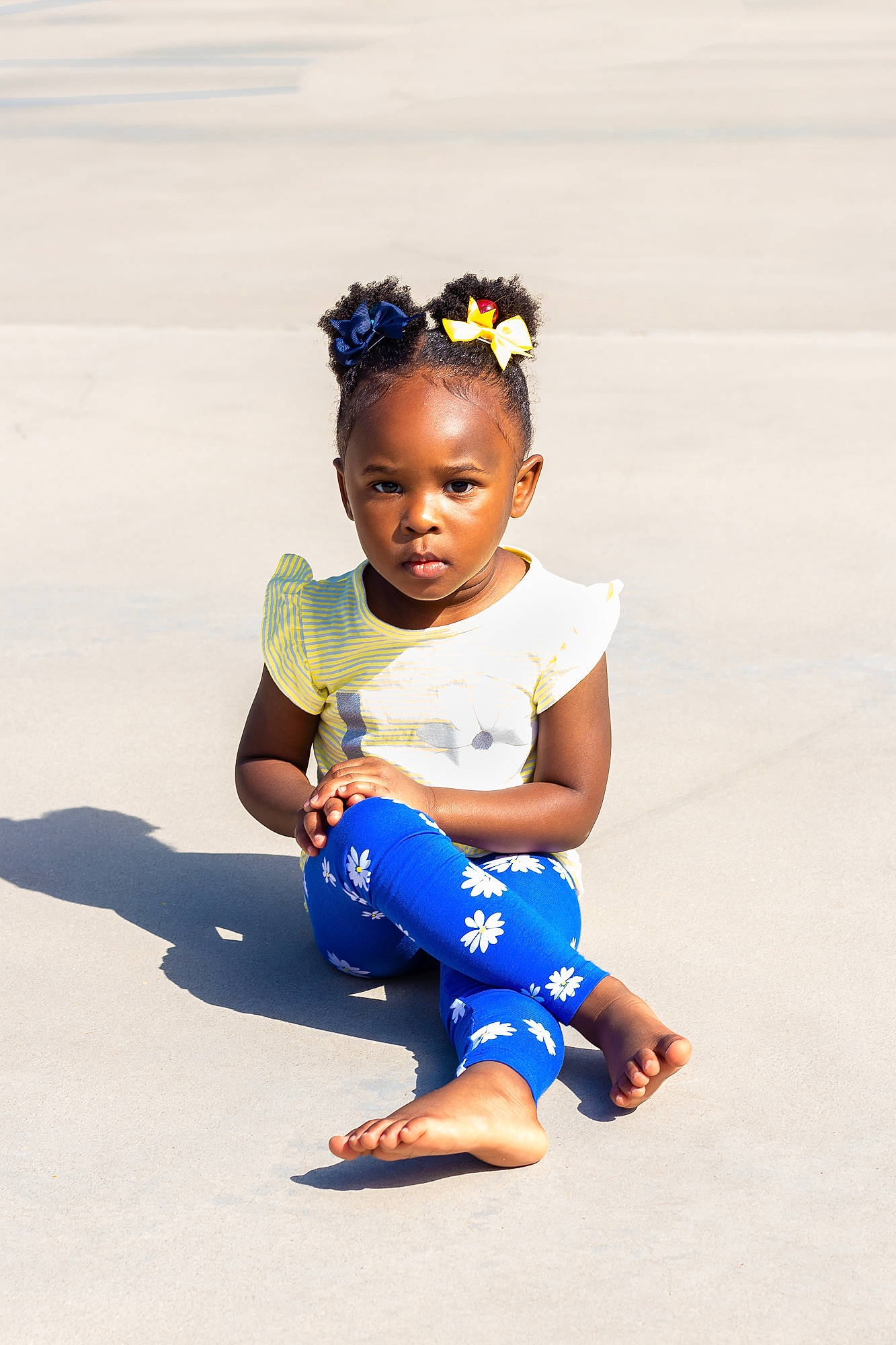 Jessica is registered to the contest to win money with this photo: baby, blue, child, footwear, fun, hair_accessory, hairstyle, happy, headband, joint, person, photo_shoot, photography, play, sitting, skin, smile, toddler, vacation, white