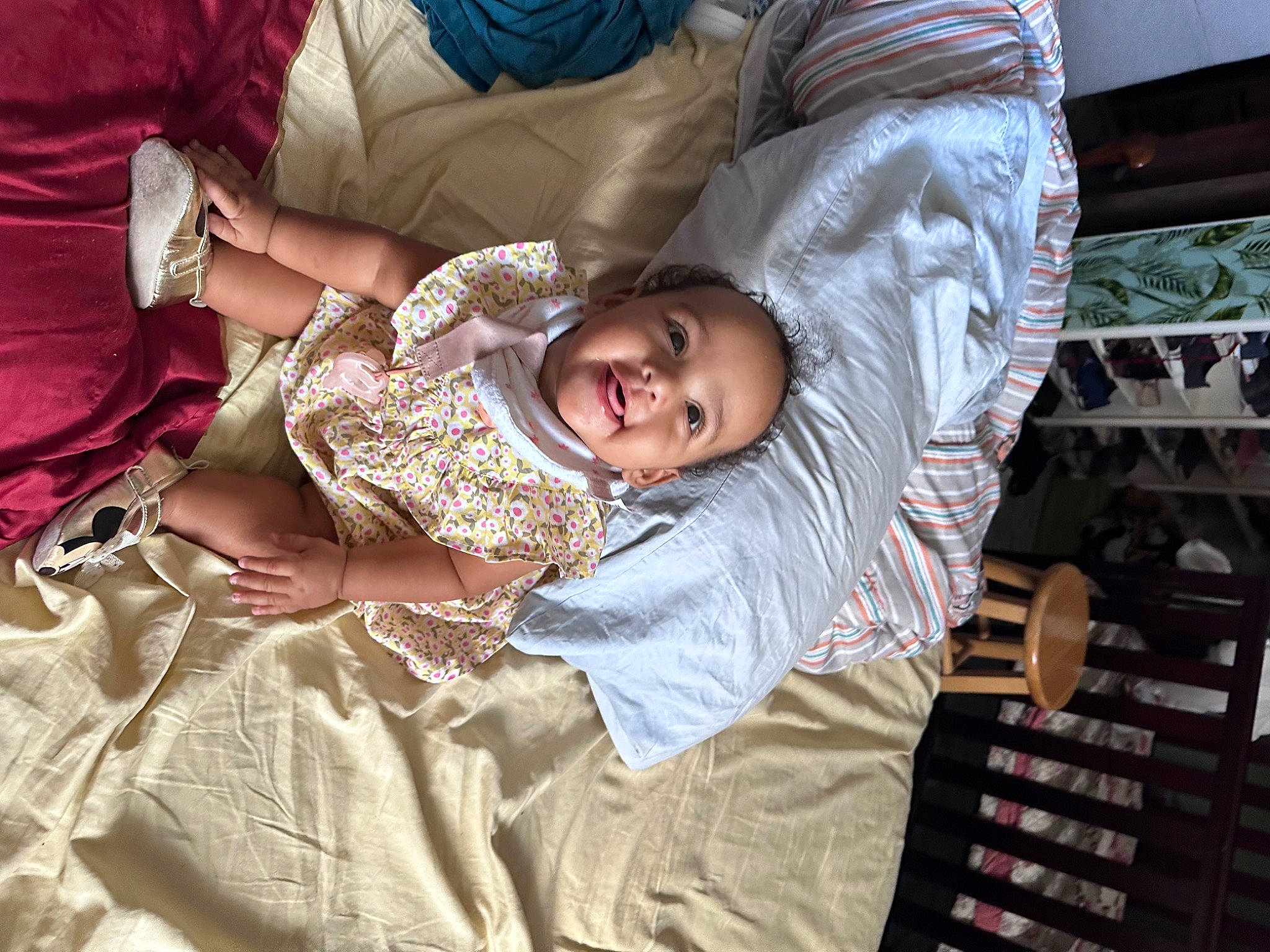 Angela is registered to the contest to win money with this photo: bed, bed_sheet, bedding, bedroom, bedtime, child, comfort, event, fun, happy, linens, nap, person, room, sari, sitting, sleep, smile, t_shirt, textile