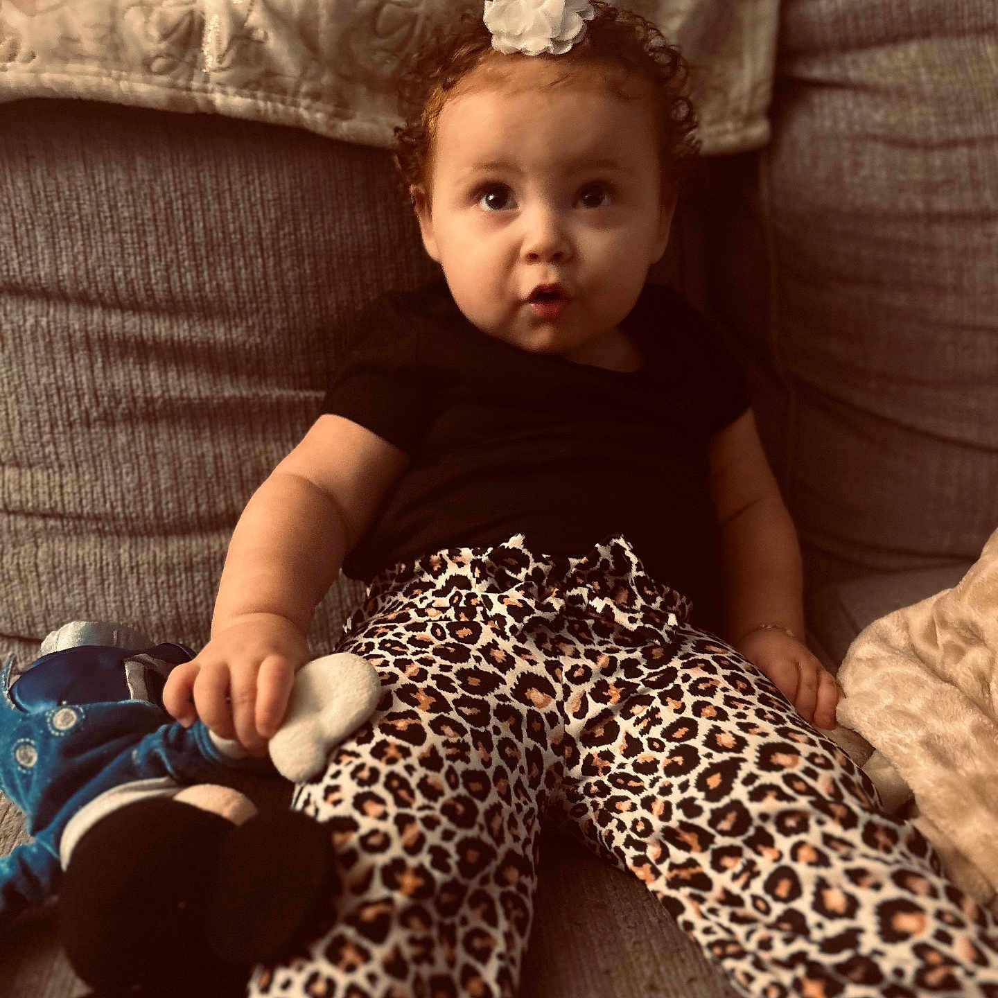 Ava joined the competition — help win amazing prizes! baby, bodypart, clothing, couch, cushion, dress, face, finger, footwear, furniture, hand, head, homedecor, indoors, pants, person, photography, portrait, shoe, sitting