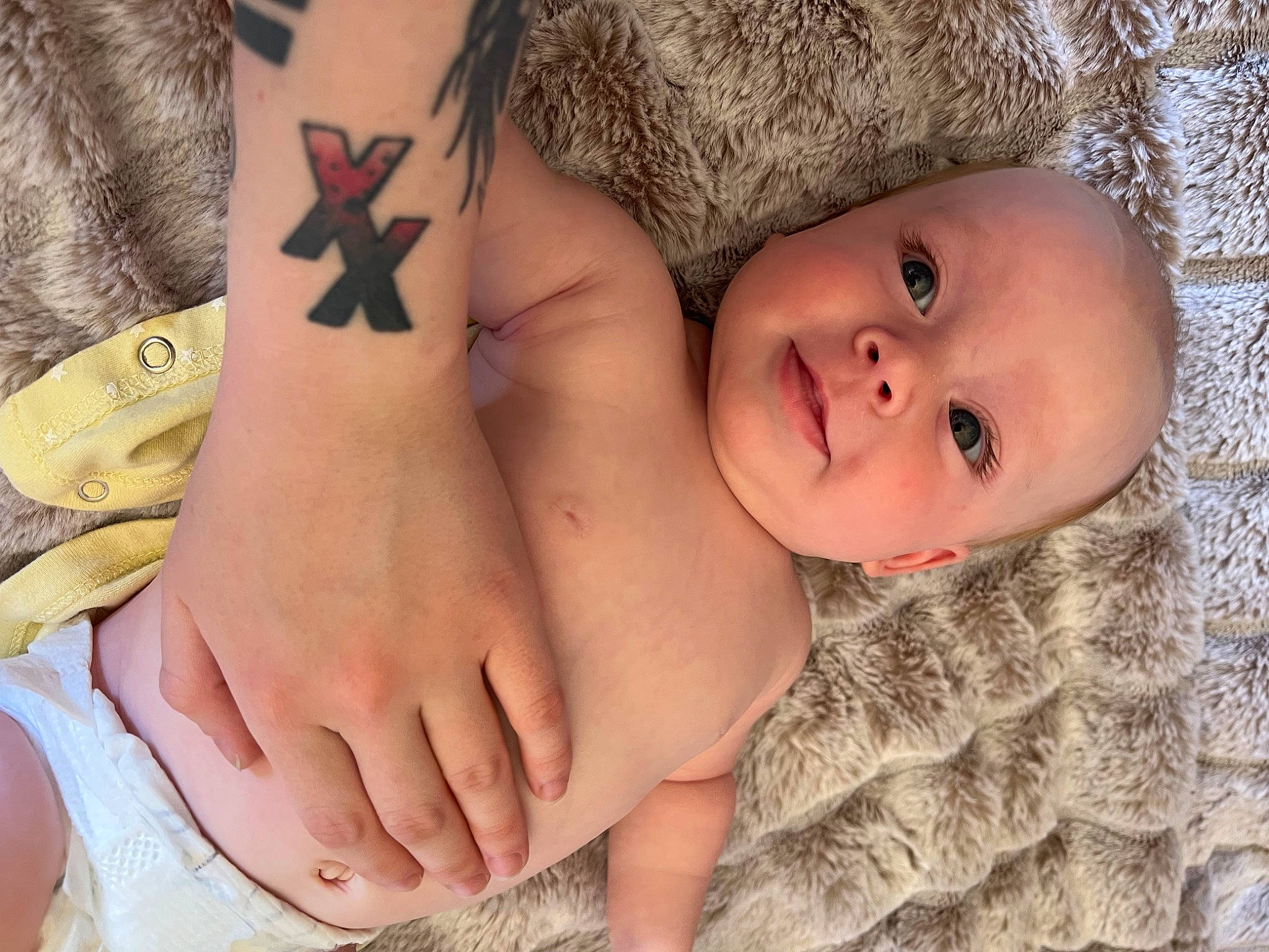 Bailey is registered to the contest to win money with this photo: abdomen, baby, chest, cross, finger, foot, happy, human_body, human_leg, muscle, nail, pattern, person, skin, stomach, temporary_tattoo, thigh, thumb, toddler, trunk