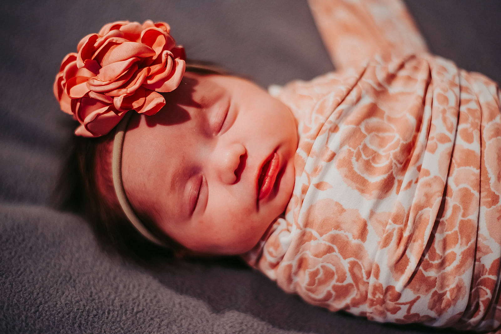 Mercedes is registered to the contest to win money with this photo: artificial_flower, baby, baby_toddler_clothing, cheek, garden_roses, hair_accessory, headband, headgear, headpiece, headwear, lip, nap, peach, person, pink, rose, rose_family, rose_order
