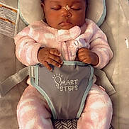 Milahnie is registered to the contest to win money with this photo: baby, infant, sleeping, car_seat, baby_bouncer, pink_pajamas, onesie, seat_harness, head_support, butterfly_sticker, hands, closed_eyes, cheeks, portrait, cute, soft_fabric, indoors, sleep, pajamas, child
