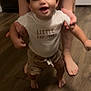 toddler, child, smiling, happy, walking, hands, feet, adult, shirt, clothing, floor, wooden_floor, indoor, person, supporting, baby, shorts, expression, cute, family